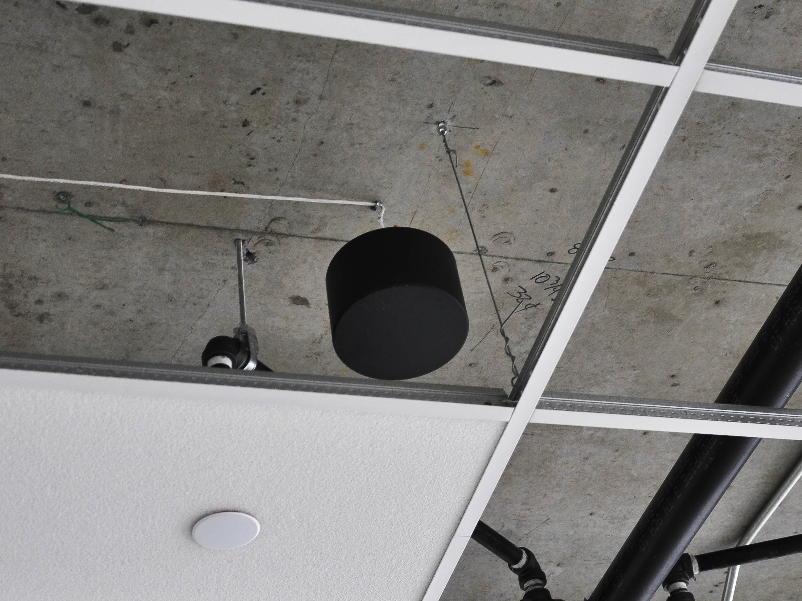 SMS-STR sound masking speaker hidden in plenum above acoustic tiles